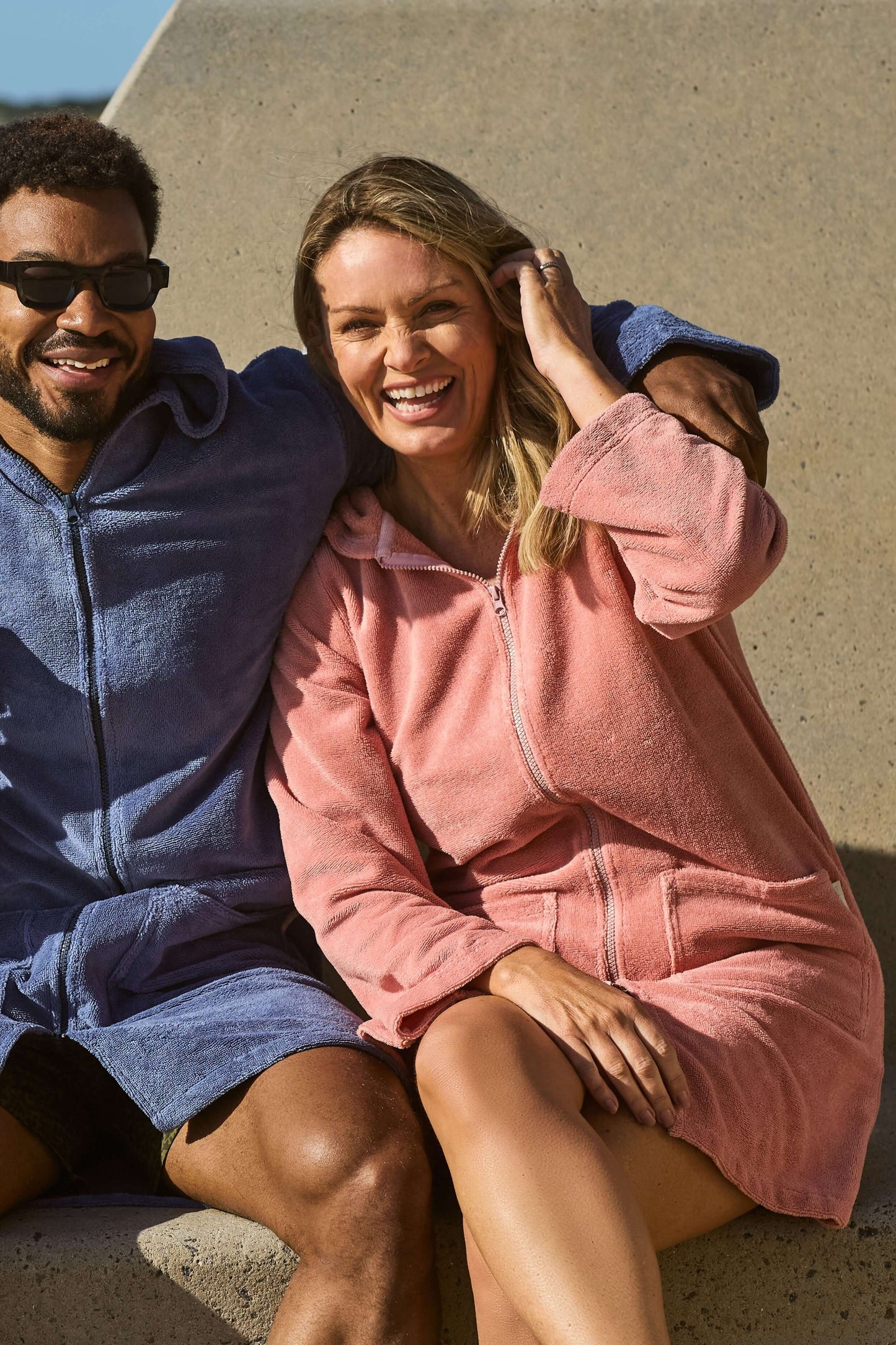 Woman smiling with her guava hooded towel on. Guava Women's Hooded Towel